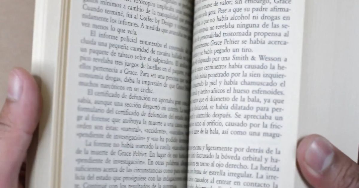 A page of a book turning slowly, in ink duotone.